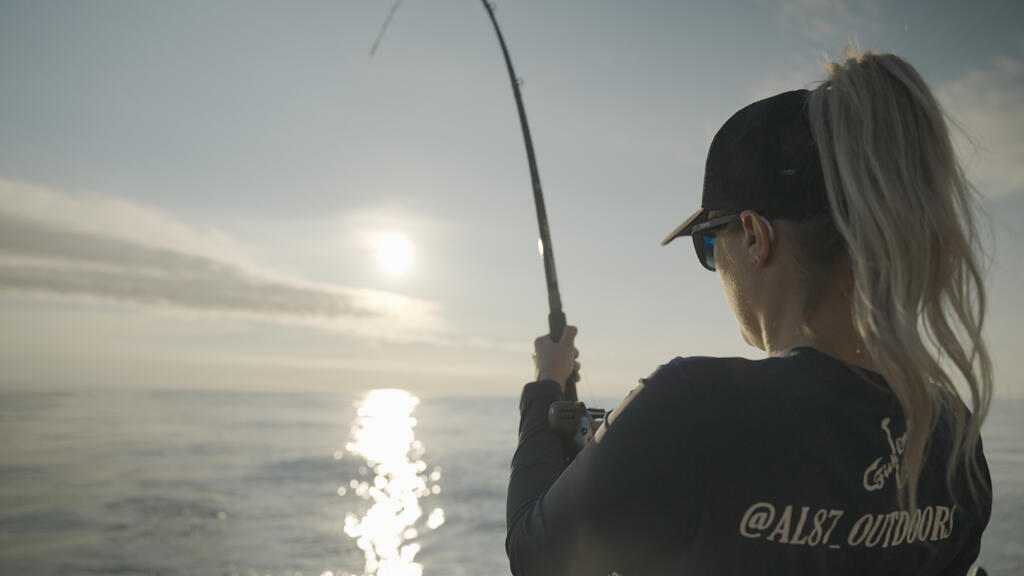 Amanda fishing on the boat