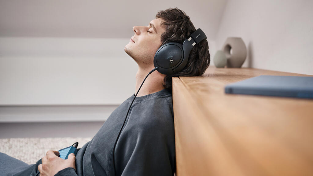 man relaxing with headphones