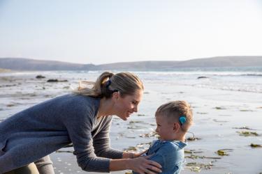AB_Photo_NaidaCI_SkyCI_MotherAndSonOnTheBeach_Phonak_AB_VirtualMediaDay_12152020.jpg