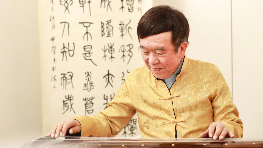 AudioNova customer Hao Shen Rong plays the guqin, a traditional Chinese instrument