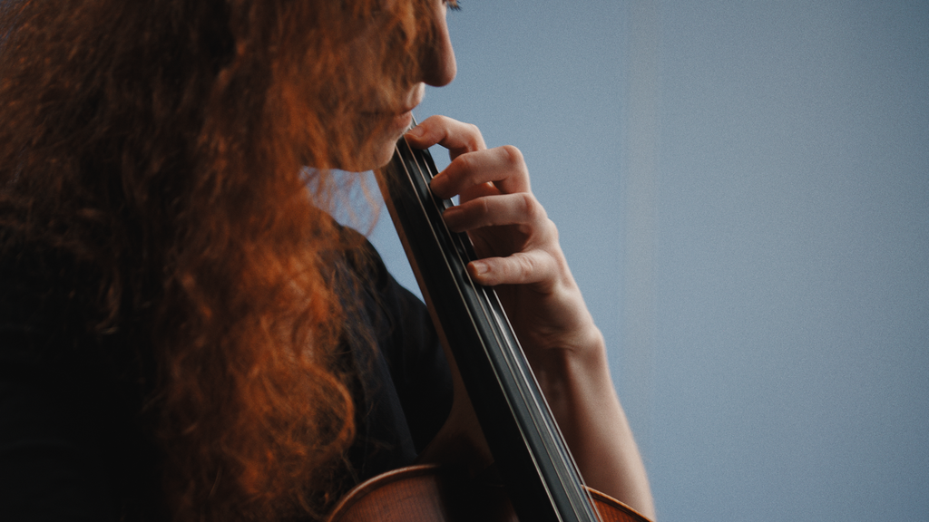 A cello player playing the instrument