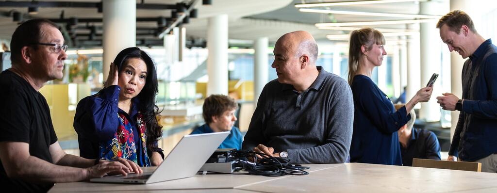 Annual Report Story Banner - Colleagues Discussing