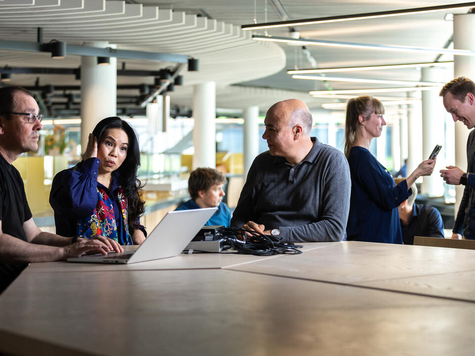 Header banner image of people discussing