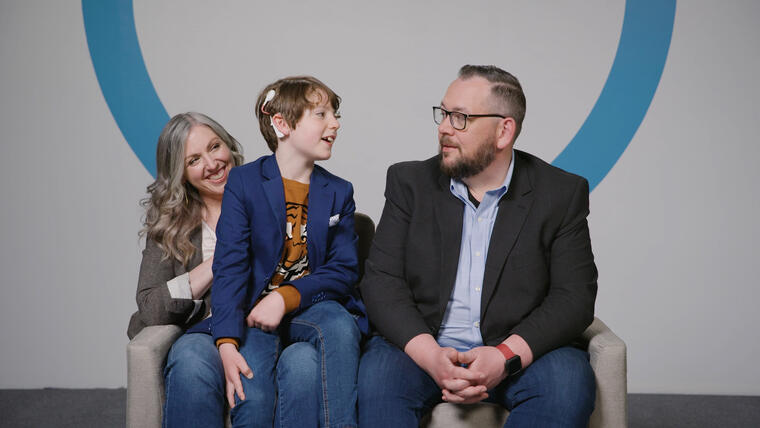 Family talking to each other boy is equipped with a cochlear implant